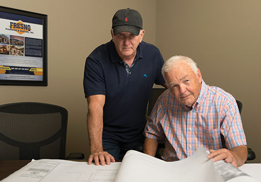 The Kumpe family has owned and managed the business since 1978. Shown here is President Larry Kumpe (right) with Chief Estimator Dalon Hankins.